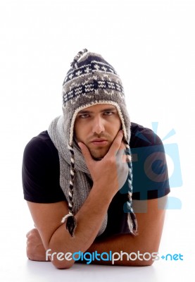 Male Lying And Wearing Woolen Cap Stock Photo