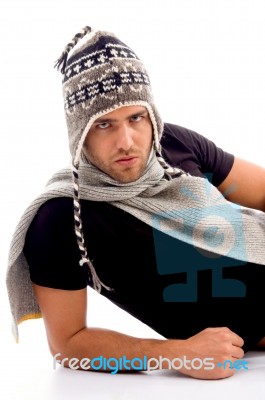 Male Lying And Wearing Woolen Cap Stock Photo