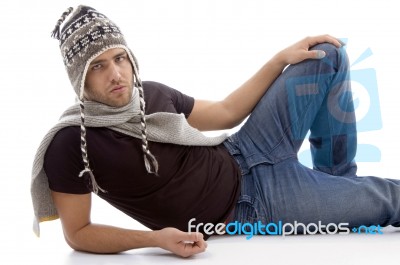 Male Lying And Wearing Woolen Cap Stock Photo