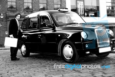 Male Passenger Opening Cab Door Stock Photo