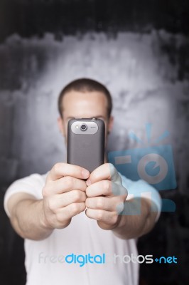 Male Photographer With Smartphone Stock Photo