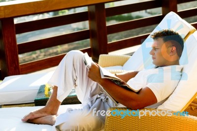 Male Reading A Book Stock Photo