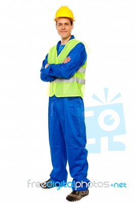 Male Repairman With Arm Crossed Stock Photo