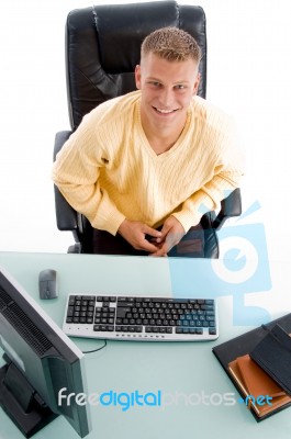 Male Sitting At Working Desk Stock Photo