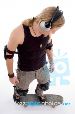 Male Standing On Skateboard Stock Photo