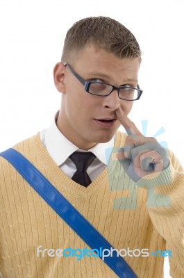 Male Student Digging His Nose Stock Photo