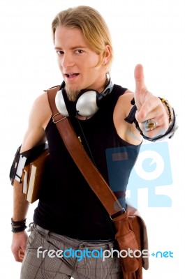 Male Student Showing Thumbs Up Stock Photo