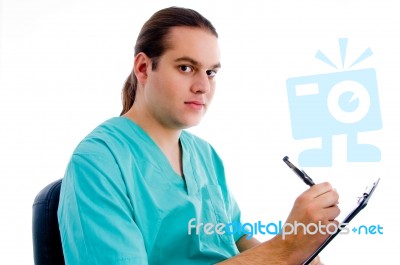 Male Surgeon Writing Prescription Stock Photo