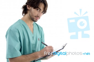 Male Surgeon Writing Prescription Stock Photo