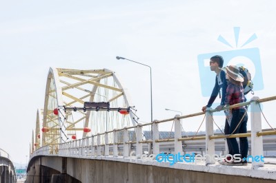 Male Tourists Enjoy The Bridge Stock Photo