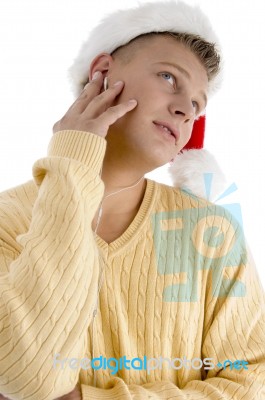 Male With Christmas Hat And Looking Upward Stock Photo