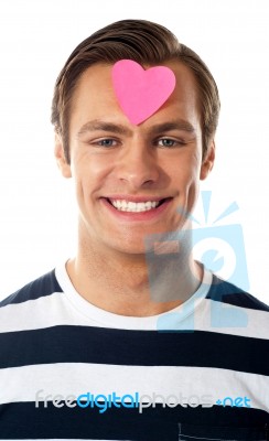 Male With Paper Heart On Forehead Stock Photo