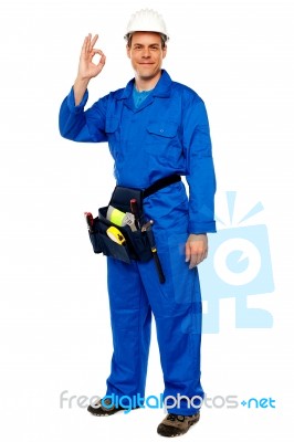 Male Worker Gesturing Okay Sign Stock Photo