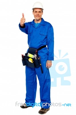 Male Worker Showing Thumbs Up Stock Photo