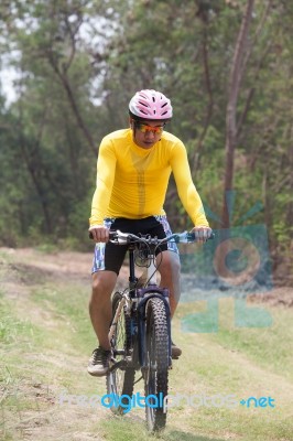 Man And Mountain Bike Riding In Jungle Track Use For Bicycle Sport Outdoor And Extreme Activities Stock Photo