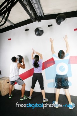 Man And Woman Doing Crossfit On Gym Stock Photo