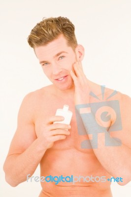 Man Applying Cream Stock Photo