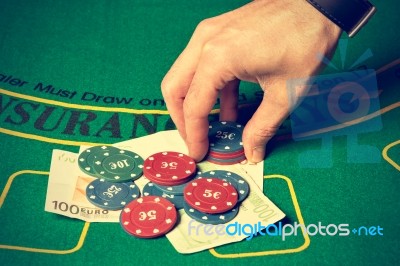 Man Betting On Poker Stock Photo