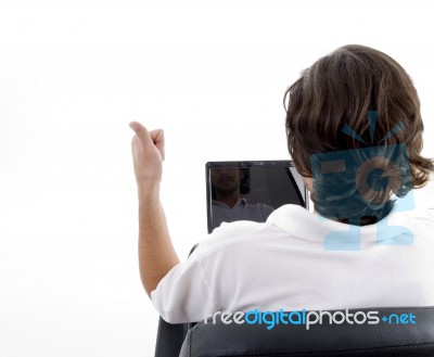 Man Busy With Laptop And Posing From Back Stock Photo