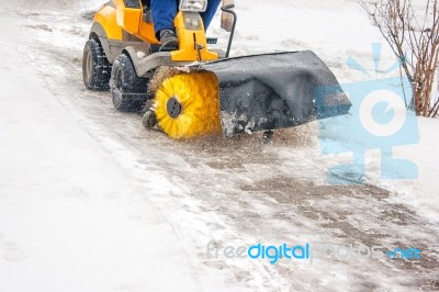 Man Cleans Snow Machines Stock Photo