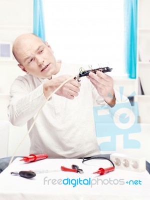 Man Doing Minor Repair At Home Stock Photo