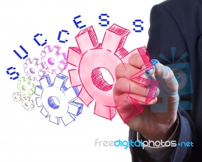 Man Drawing Gear To Success Stock Image