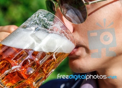 Man Drinking Beer From Mug Closeup Stock Photo