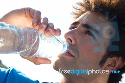 Man Drinking Water After Sport Activities Stock Photo