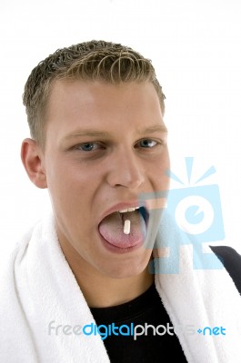 Man Eating Capsule Stock Photo