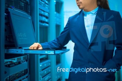 Man Fix Server Network In Data Center Room Stock Photo