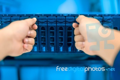 Man Fix Server Network In Data Center Room Stock Photo