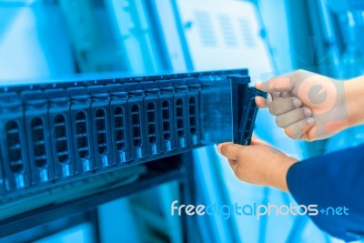 Man Fix Server Network In Data Center Room Stock Photo