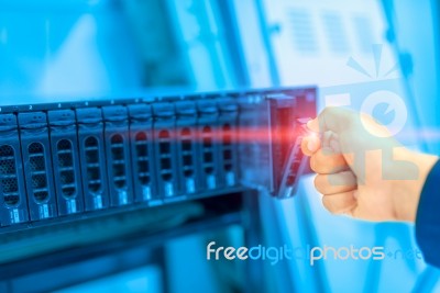 Man Fix Server Network In Data Center Room Stock Photo