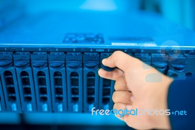 Man Fix Server Network In Data Center Room Stock Photo