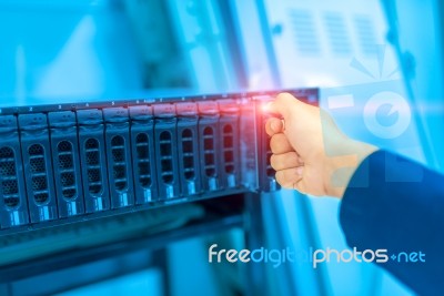 Man Fix Server Network In Data Center Room Stock Photo