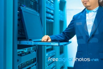 Man Fix Server Network In Data Center Room Stock Photo