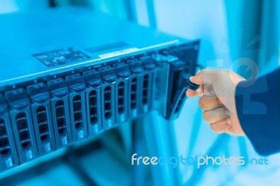 Man Fix Server Network In Data Center Room Stock Photo