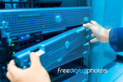 Man Fix Server Network In Data Center Room Stock Photo