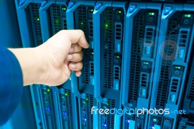 Man Fix Server Network In Data Center Room Stock Photo