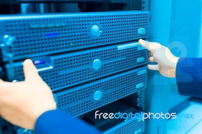 Man Fix Server Network In Data Center Room Stock Photo