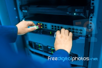 Man Fix Server Network In Data Center Room Stock Photo