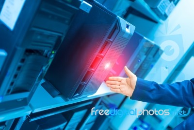 Man Fix Server Network In Data Center Room Stock Photo