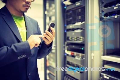 Man Fix Server Network In Data Center Room Stock Photo