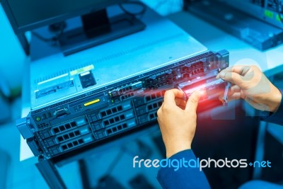 Man Fix Server Network In Data Center Room Stock Photo