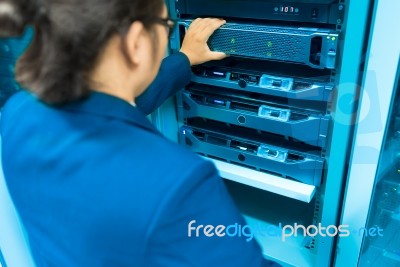 Man Fix Server Network In Data Center Room Stock Photo