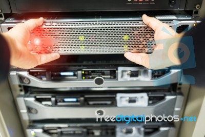 Man Fix Server Network In Data Center Room Stock Photo