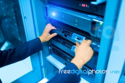 Man Fix Server Network In Data Center Room Stock Photo