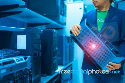 Man Fix Server Network In Data Center Room Stock Photo