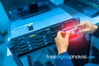 Man Fix Server Network In Data Center Room Stock Photo