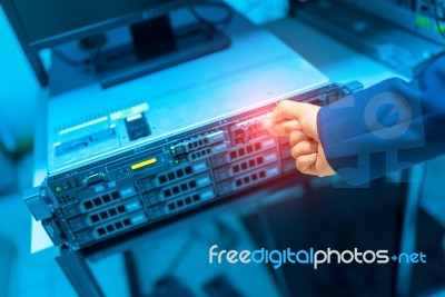 Man Fix Server Network In Data Center Room Stock Photo